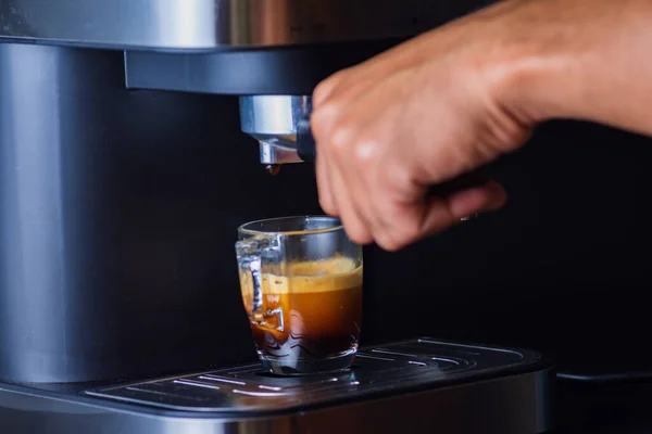 Espresso coffee from a drip-glass coffee machine