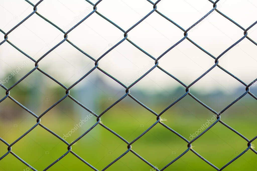 Coil, fence, wall, field in the park