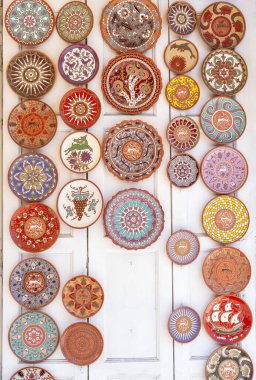 Decorative dishes and plates are sold in the old market in Rhodes Greece.
