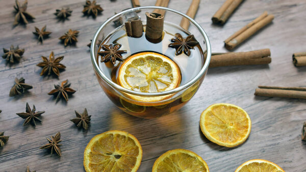 Tea with lemon slices and anise, cinnamon.Herbal tee