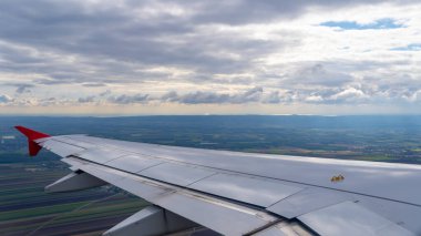 View of an airplane wing and sky as background.