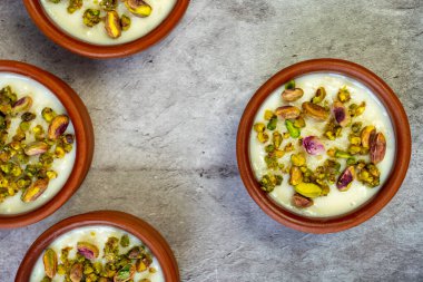 Milk Rice in pottery bowl flat lay, copy space.
