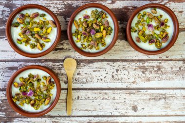 Milk Rice in pottery bowl flat lay, copy space.