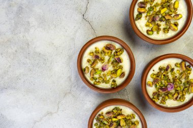 Milk Rice in pottery bowl flat lay, copy space.