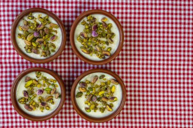 Milk Rice in pottery bowl flat lay, copy space.