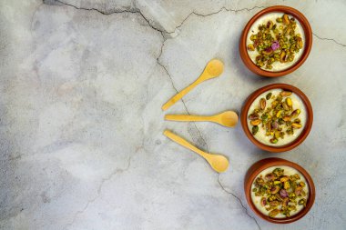 Milk Rice in pottery bowl flat lay, copy space.