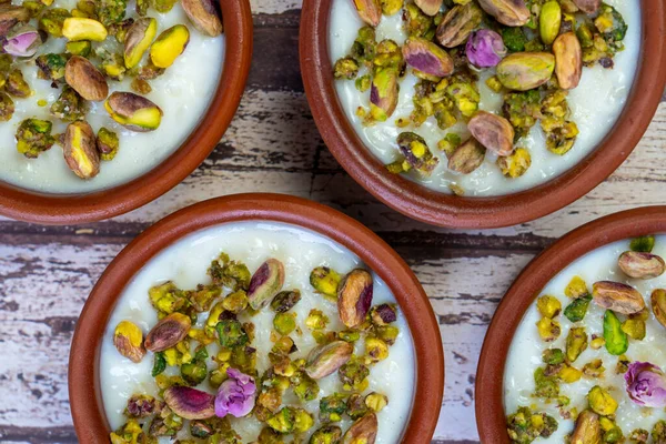 Milk Rice in pottery bowl flat lay, copy space.