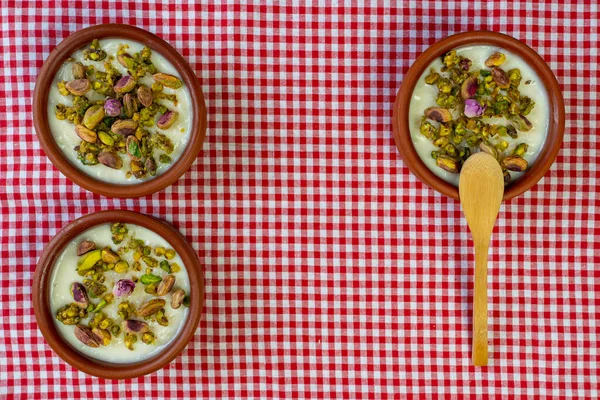 Milk Rice in pottery bowl flat lay, copy space.