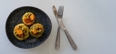 cooked spiny artichoke with olive oil and Carrots and peas,Top view ,selective focos