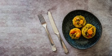 cooked spiny artichoke with olive oil and Carrots and peas,Top view ,selective focos