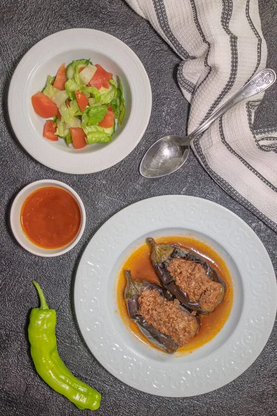 Karnyark dish found in Turkish cuisine consisting of eggplant stuffed with a mix of  chopped onions, tomatoes,  parsley and ground meat. Top view