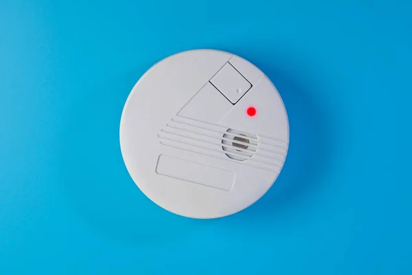 Smoke detector on the ceiling in case of fire alarm due to smoke as fire protection warning