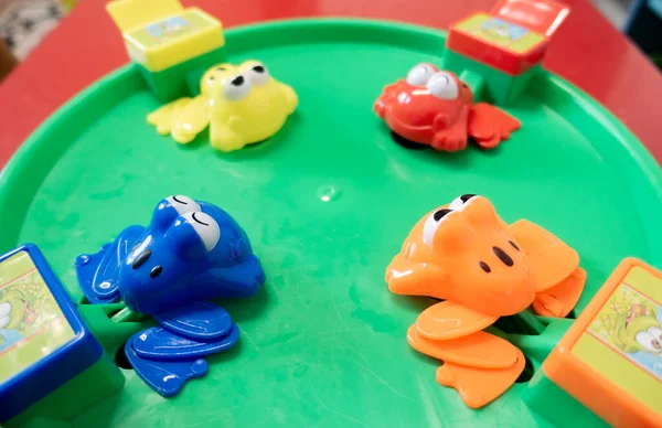 Jumping frog toy close up is a Family Game