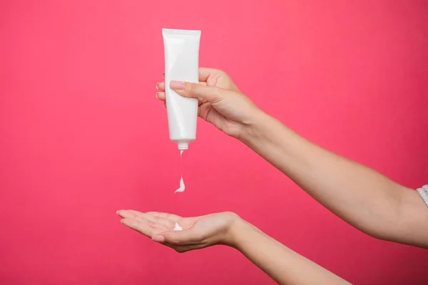 Female Hands Apply Cosmetic Skin Care Moisturizer Cream Pink Background — 스톡 사진
