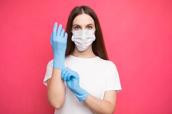 Young Woman Patient Medical Mask Puts Protective Surgical Sterile Gloves — 스톡 사진