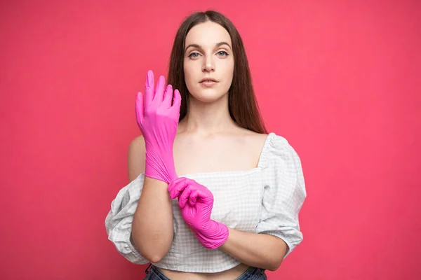 Young Woman Puts Protective Surgical Sterile Gloves Her Arm Isolated — 스톡 사진