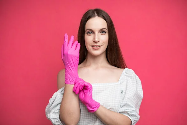 Young Woman Puts Protective Surgical Sterile Gloves Her Arm Isolated — 스톡 사진