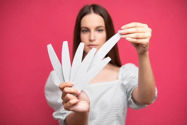 Picture Young Girl Holding Nail Files Choosing One Them High — Stock fotografie