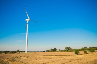Windmills for electricity generation. Green energy concept. Background with copy space for text. Huge blades close up. High quality photo
