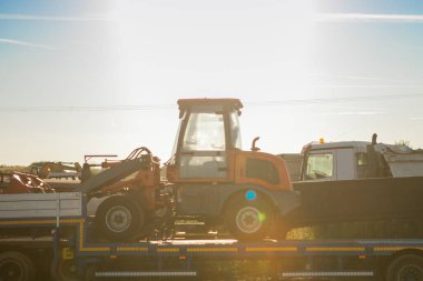 red tractor in sunset light . High quality photo