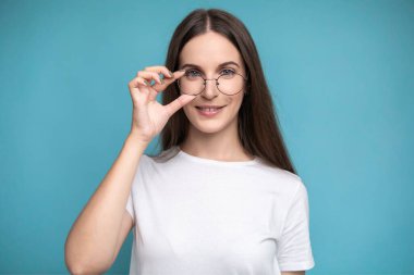 Beautiful smiling woman wearing glasses. High quality photo