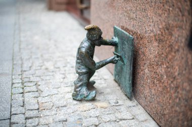 Poland, Wroclaw - April 2022. Dwarf, gnome, famous small statues in Wroclaw. High quality photo