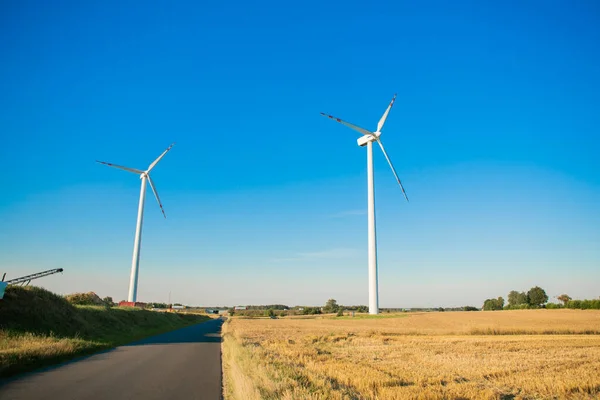 Windmills for electricity generation. Green energy concept. Background with copy space for text. Huge blades close up. High quality photo