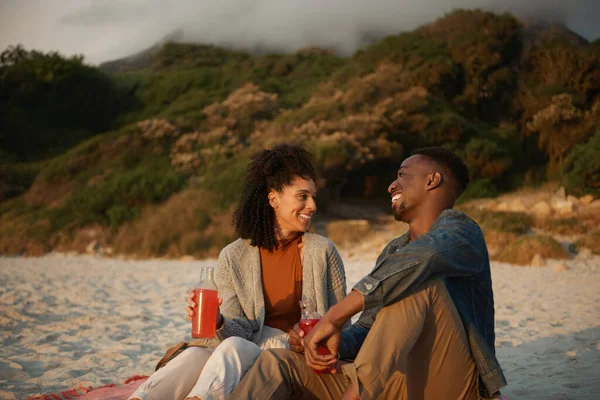 Carefree Young Multiethnic Couple Laughing While Drinking Juice Together Blanket — Foto de Stock