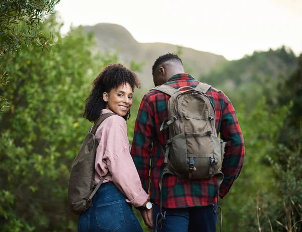 Smiling Young Multiethnic Couple Holding Hands Together While Out Hiking — Photo