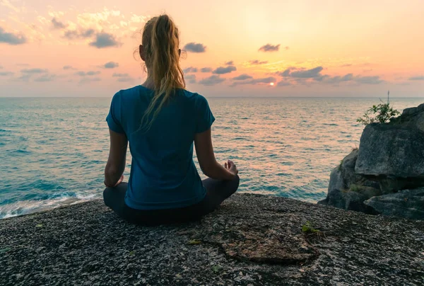 Young Woman Lotus Position Meditates Rocks Sea Sunrise Colorful Sky — Stock Photo, Image