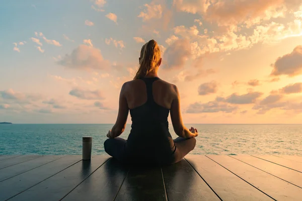 Young Woman Meditating Black Clothes Yoga Wooden Deck Top Sea — Stock Photo, Image