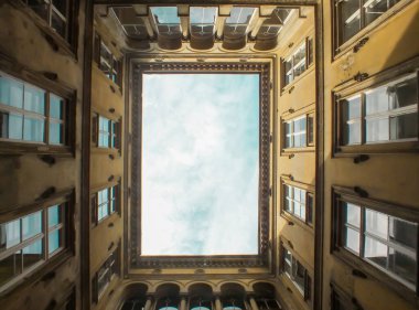 Upward photo of an old building's yard, patio, veranda, Architecture on the Pest side of Budapest, inner courtyard, gothic, renaissance, baroque,classicism, art nouveau, romantic style horizontal