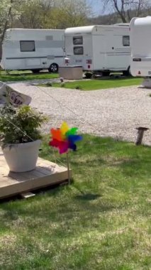 Colorful weather vane spinning in a natural Caravan Camping ground, Pinwheel spins in the wind at the campsite. Agva, Istanbul, Turkey.
