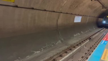 Metro train approaches the platform at Kadikoy Metro Station on the M4 line, Asian part. Istanbul, Turkey - February 26, 2022.