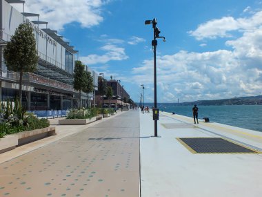 Galataport and the Bosphorus on background, Istanbul Modern Museum, cruise port of Istanbul, shores of Tophane. Karakoy, Istanbul, Turkey - July 13 2022.