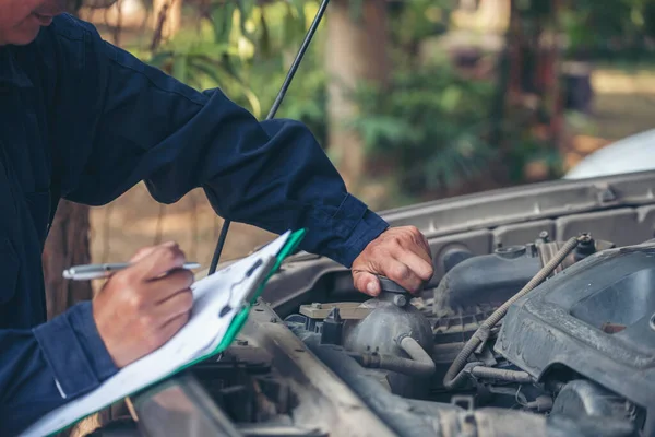 Mechanic car service auto garage in automotive mobile center. Technician workshop repair engine motor vehicles service mechanical engineering business. Automobile mechanic hands car repairs technic