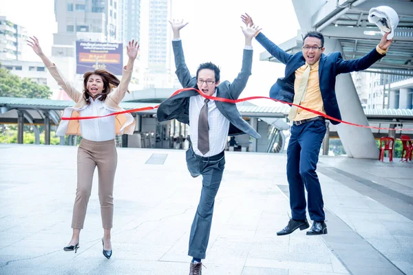 Business competition group of business people in formal suit run to finish line success goal victory strategy. Competitive person race to be first place winner. Multiethnic diversity people contest.