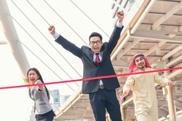 Business competition group of business people in formal suit run to finish line success goal victory strategy. Competitive person race to be first place winner. Multiethnic diversity people contest.