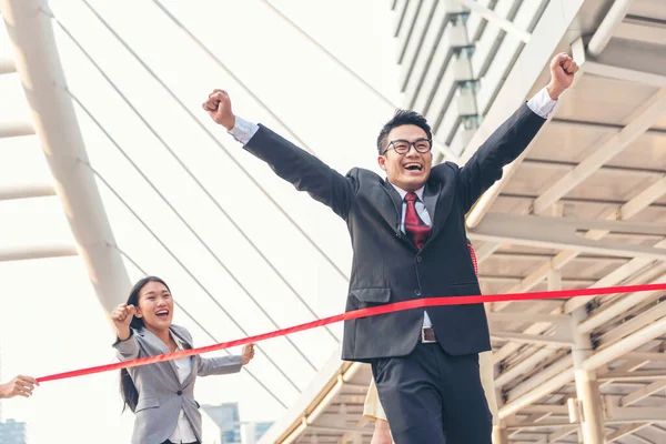 Business competition group of business people in formal suit run to finish line success goal victory strategy. Competitive person race to be first place winner. Multiethnic diversity people contest.