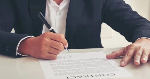 Businessman hand using pen signing on new contract to starting projects in conference room. Close up business manager man hands sign contract legal document in meeting room. Business agreement concept