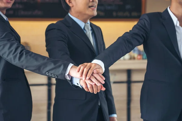 Group of diversity people fist bump holding hands together power of tag team. Teamwork Multiethnic people group working togetherness. Business people team holding hands successful. Business meeting