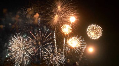 Golden Firework celebrate anniversary happy new year 2023, 4th of july holiday festival. Gold firework in the night time celebrate national holiday. Countdown to new year 2022 gold party time event