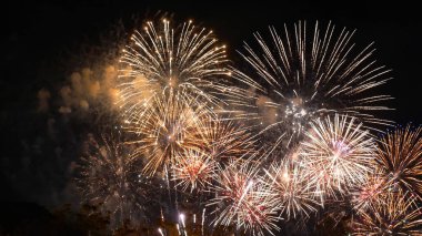 Golden Firework celebrate anniversary happy new year 2023, 4th of july holiday festival. Gold firework in the night time celebrate national holiday. Countdown to new year 2022 gold party time event