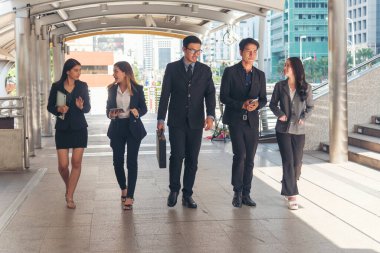 Crowd worker group of people busy life with businesswoman, man in urban street city lifestyle. Business People Concept. Crowd business people walking go to work in modern city life to working office