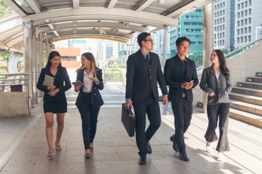 Crowd worker group of people busy life with businesswoman, man in urban street city lifestyle. Business People Concept. Crowd business people walking go to work in modern city life to working office