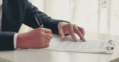 Asian business man using pen signing on new contract to starting projects in conference room. Close up manager businessman hands sign contract working meeting. Business agreement concepts.
