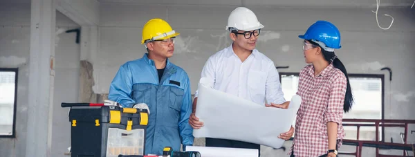 Banner Civil construction engineer team meeting on construction site with partner teamwork trust team consult together. Panorama image engineer team discuss wear hard hat construction engineer concept