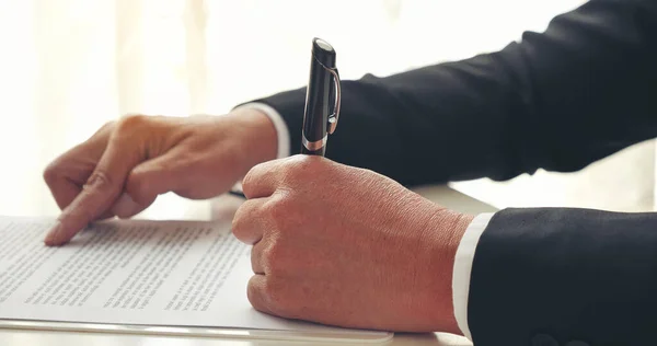 Businessman hand using pen signing on new contract to starting projects in conference room. Close up business manager man hands sign contract legal document in meeting room. Business agreement concept