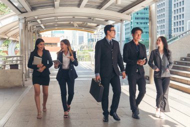 Crowd worker group of people busy life with businesswoman, man in urban street city lifestyle. Business People Concept. Crowd business people walking go to work in modern city life to working office