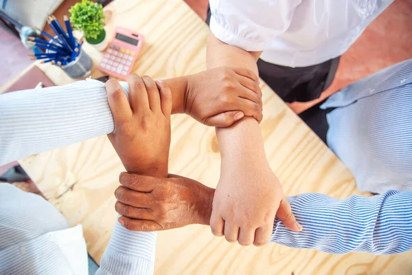 Diverse multiethnic Partners hands together teamwork group of multiracial people meeting join hands togetherness. Diversity people hands join empower partnership teams connection volunteer community